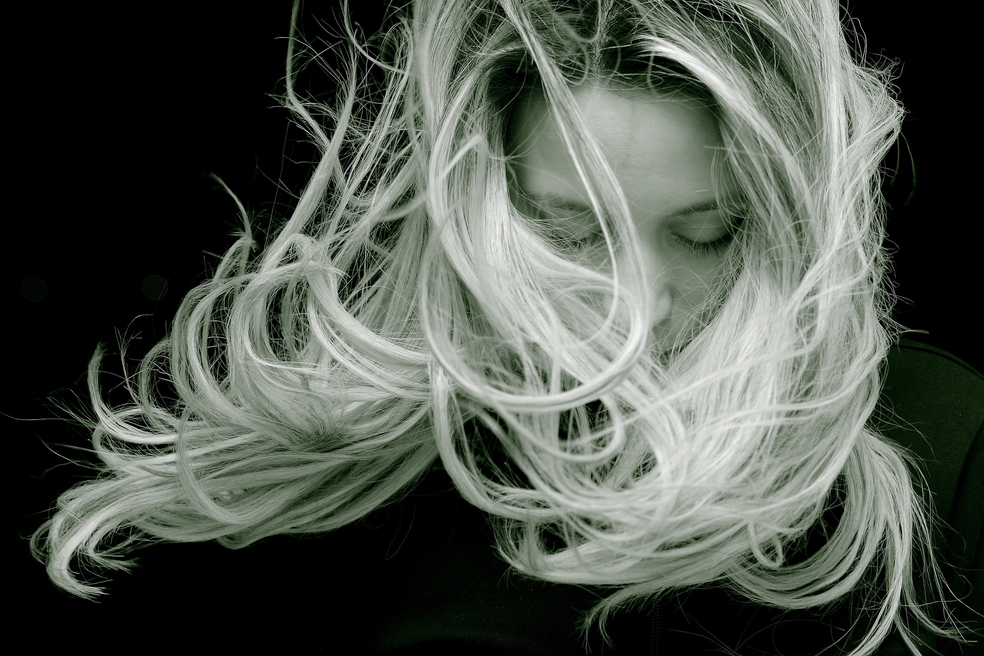 Black and white photo of woman with long blonde hair