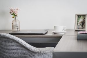 A work space with a desk and chair