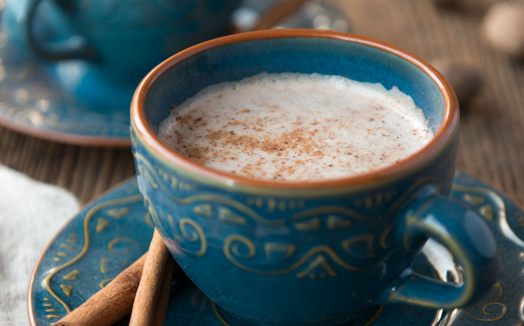 A cup of herbal tea for stomach upset in a blue cup.