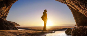 A man at sunset in a rock canyon