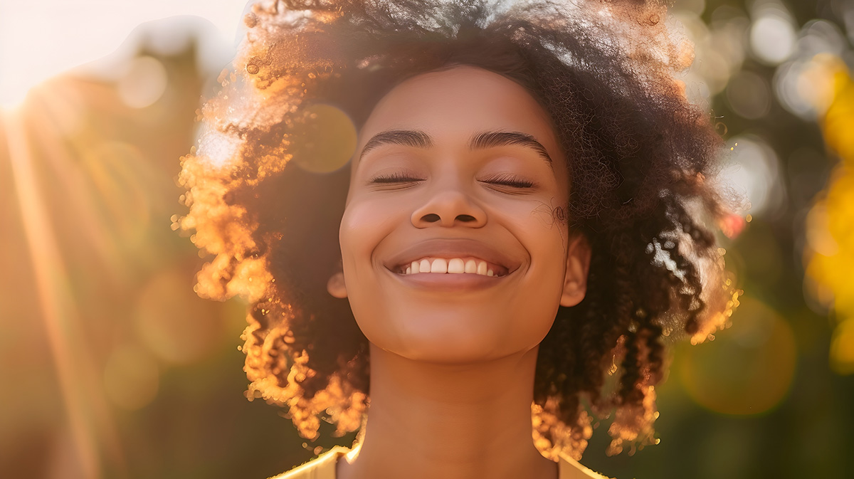 Happy and stress free woman smiling outdoors.