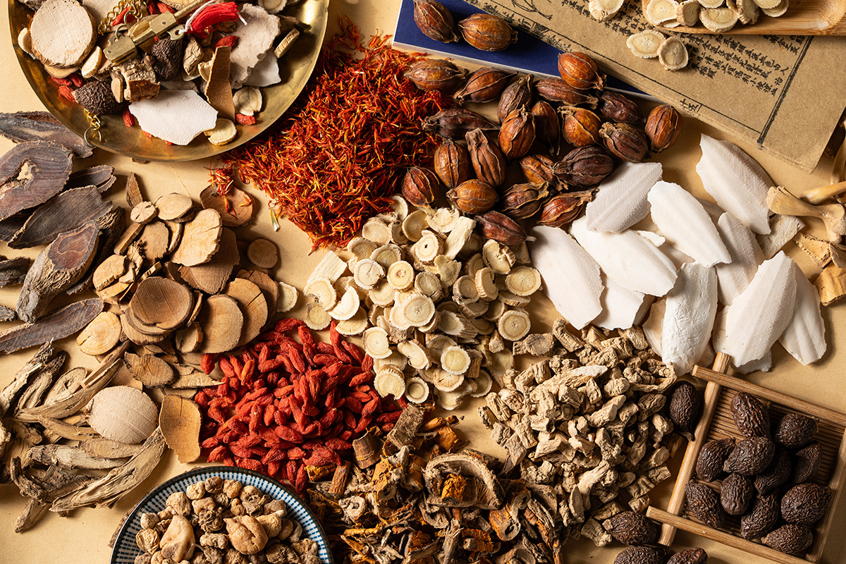 Ancient Chinese medicine and different herbal ingredients on tab