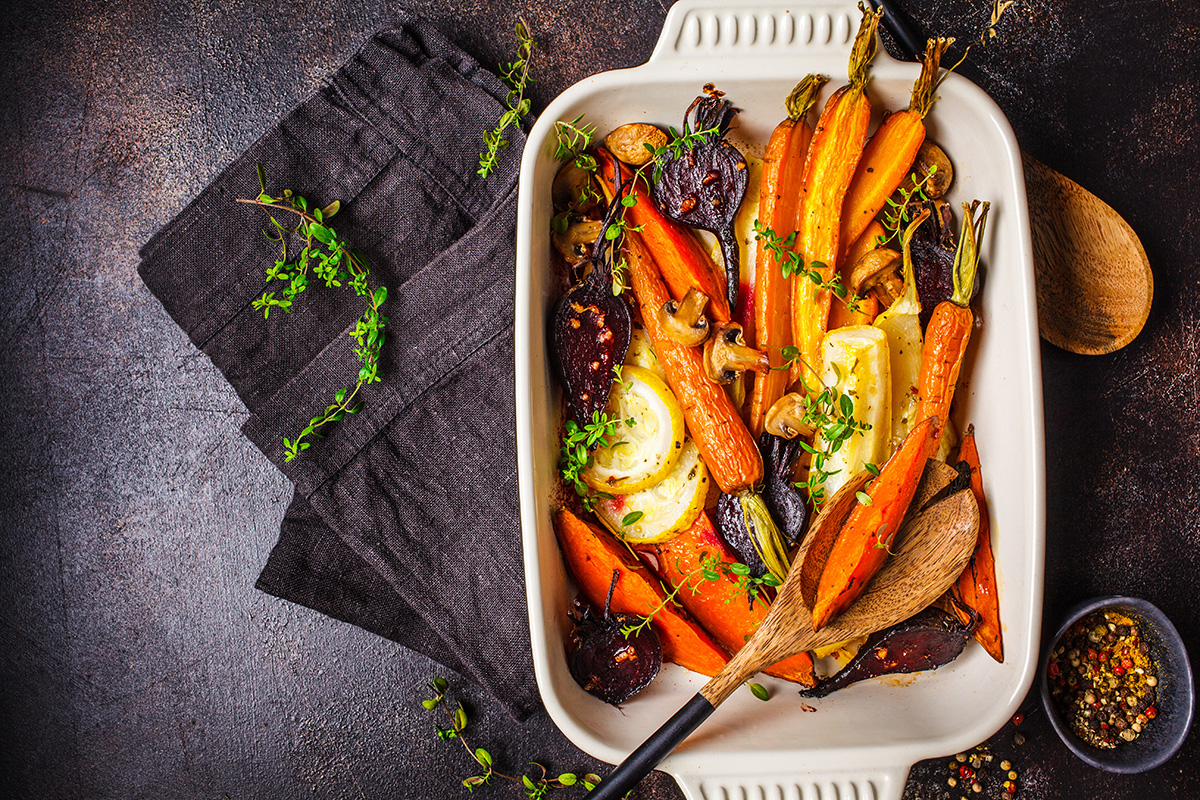 Baked carrots, sweet potatoes, beets and zucchini in oven dish