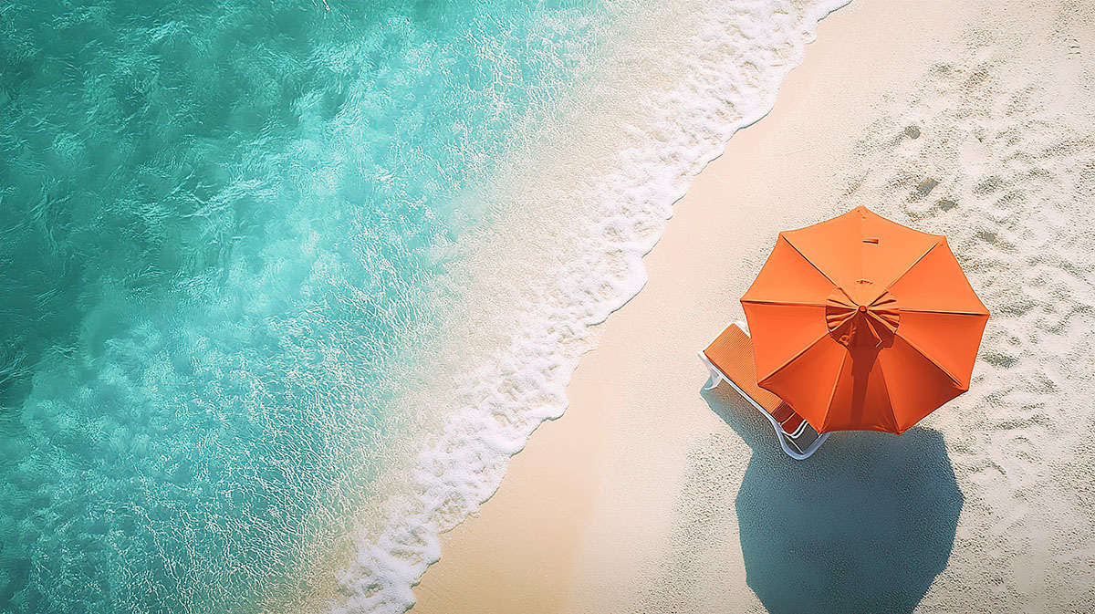 Beautiful beach with turquoise water and orange umbrellas